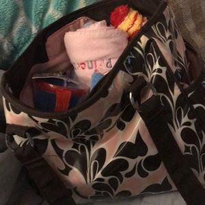 Diaper bag full of newborn baby things